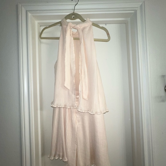 Adorable cream chiffon ruffle short romper with tie back. Open winged back. - Picture 2 of 13